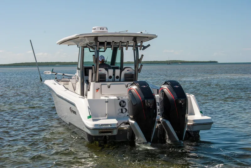 Slide: The Image of 2023 Crevalle 33 CSF boat with dual engines on calm water. - 75