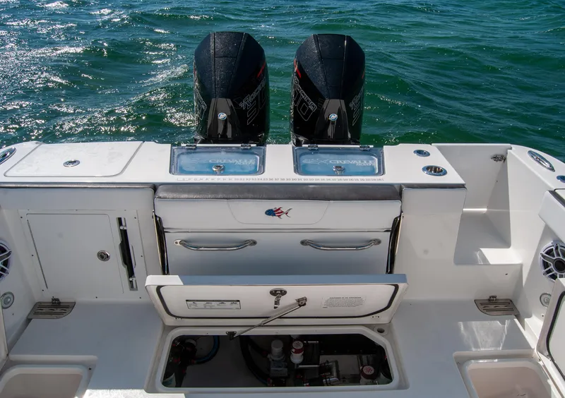 Slide: The Image of 2023 Crevalle 33 CSF boat with dual engines and open storage compartments. - 8