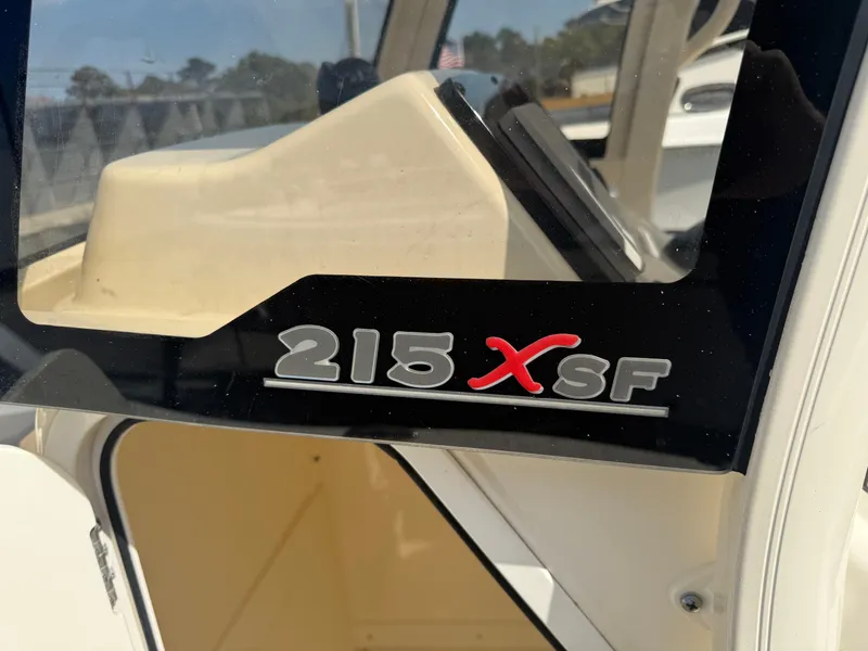 Slide: The Image of 2023 Scout 215 XSF boat logo on console, close-up view. - 26