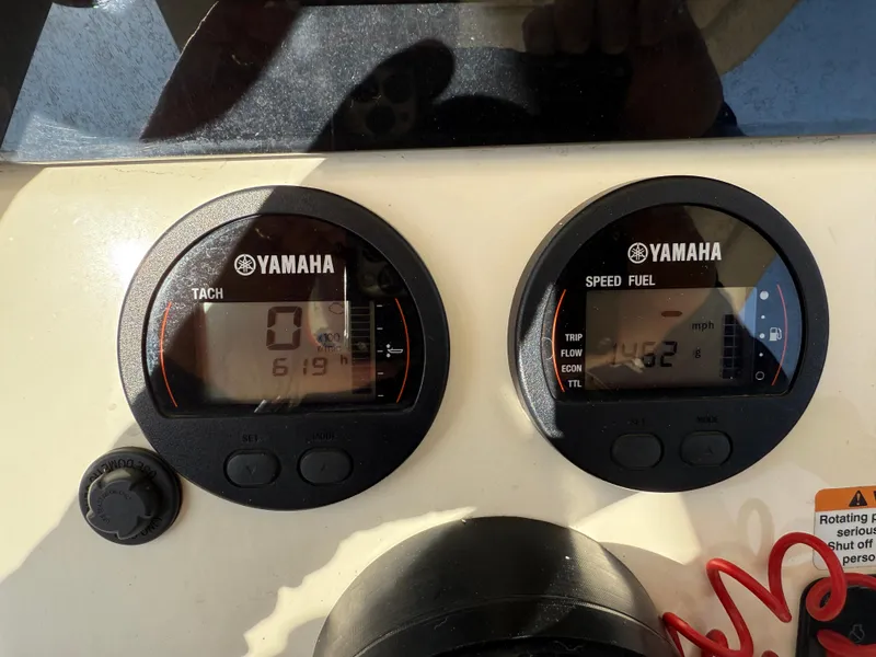Slide: The Image of Yamaha gauges on 2023 Scout 215 XSF boat dashboard, displaying tachometer and speed fuel readings. - 35