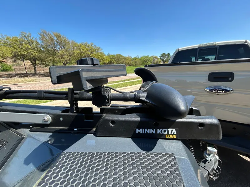 Slide: The Image of 2023 Ranger RT178 boat with Minn Kota Edge trolling motor, parked near a white truck. - 10