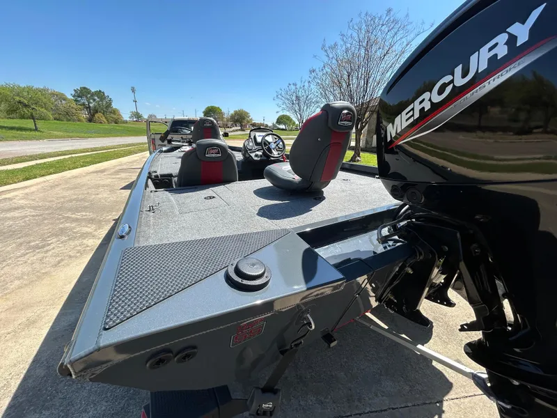 Slide: The Image of 2023 Ranger RT178 boat with Mercury engine, parked outdoors on a sunny day. - 15