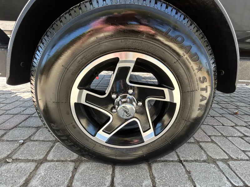 Slide: The Image of 2023 Ranger RT178 wheel with Load Star tire on cobblestone pavement. - 19
