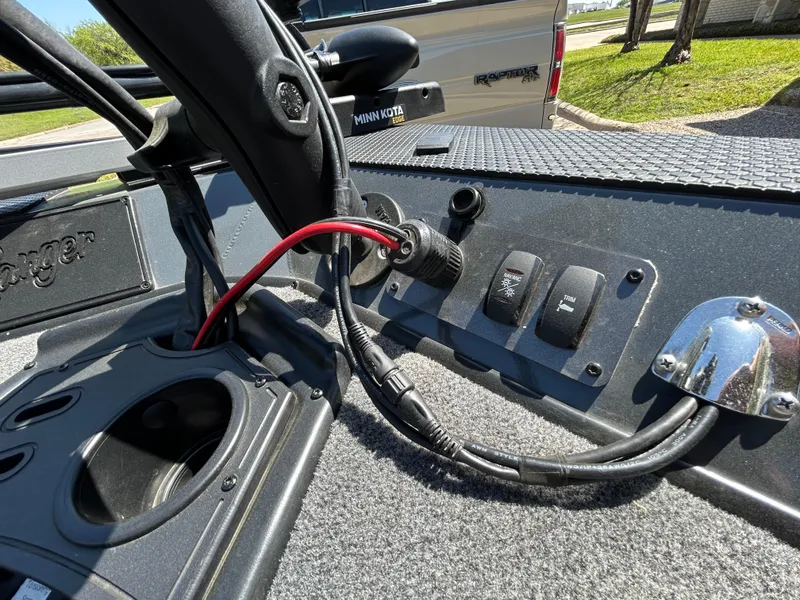 Slide: The Image of 2023 Ranger RT178 boat dashboard with switches and wiring, featuring a Minn Kota motor. - 22