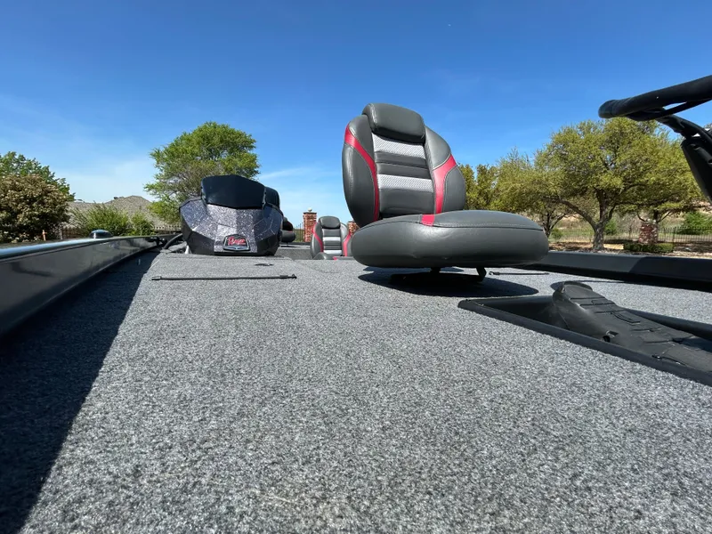 Slide: The Image of 2023 Ranger RT178 boat interior with seating, under clear blue sky. - 23