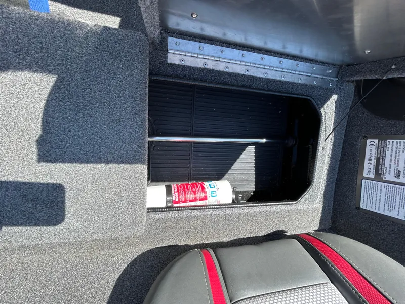 Slide: The Image of 2023 Ranger RT178 boat storage compartment with a fire extinguisher inside. - 24