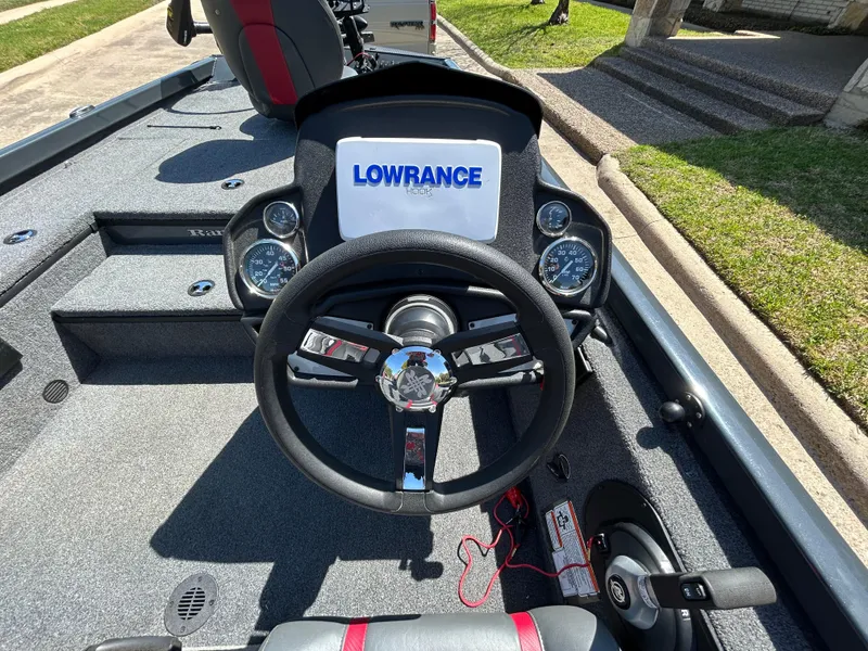 Slide: The Image of 2023 Ranger RT178 boat dashboard with Lowrance display and steering wheel. - 31