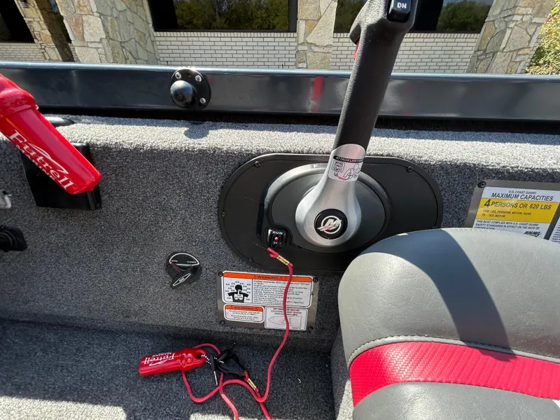 Slide: The Image of 2023 Ranger RT178 boat interior with control lever and safety features. - 32