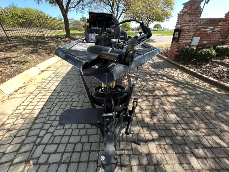 Slide: The Image of 2023 Ranger RT178 boat trailer with equipment on cobblestone driveway. - 35