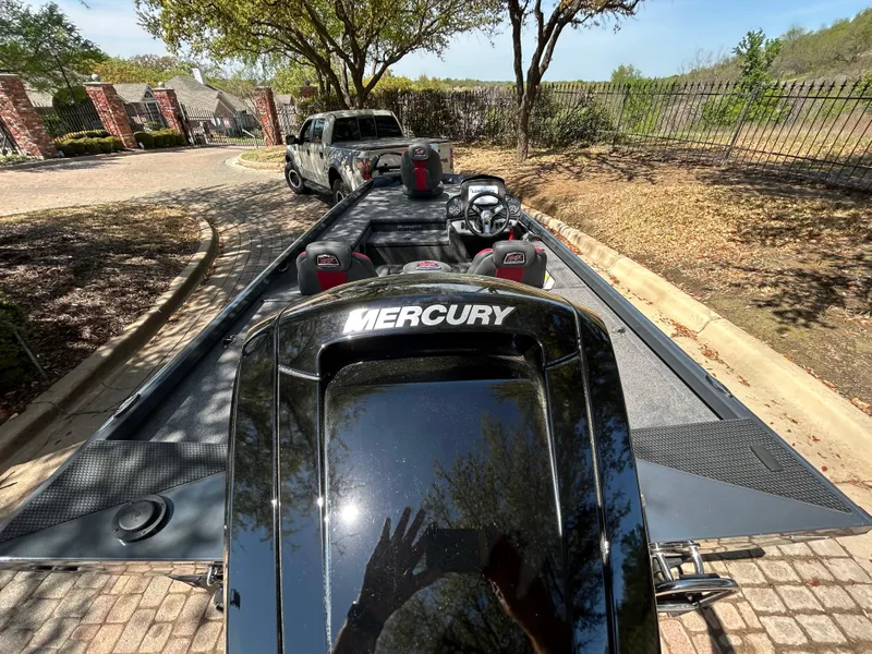 Slide: The Image of 2023 Ranger RT178 boat with Mercury engine on trailer, parked outdoors. - 42