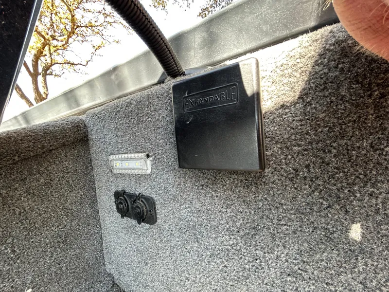 Slide: The Image of 2023 Ranger RT178 boat interior with electrical panel and carpeted finish. - 43