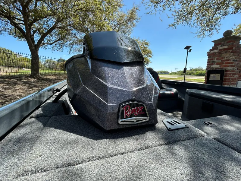 Slide: The Image of 2023 Ranger RT178 boat console under trees, showcasing sleek design and craftsmanship. - 44