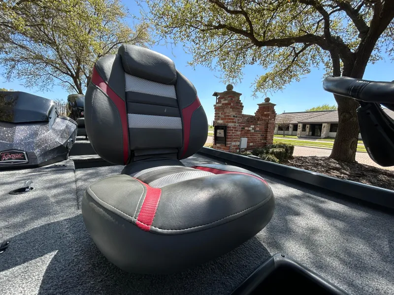 Slide: The Image of 2023 Ranger RT178 boat seat with red accents under sunny sky. - 45