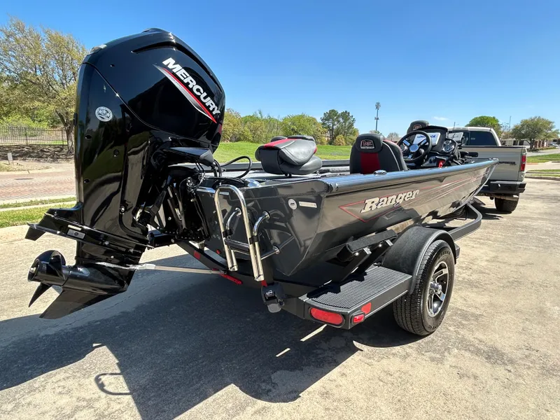 Slide: The Image of 2023 Ranger RT178 boat with Mercury engine on trailer, parked outdoors. - 6