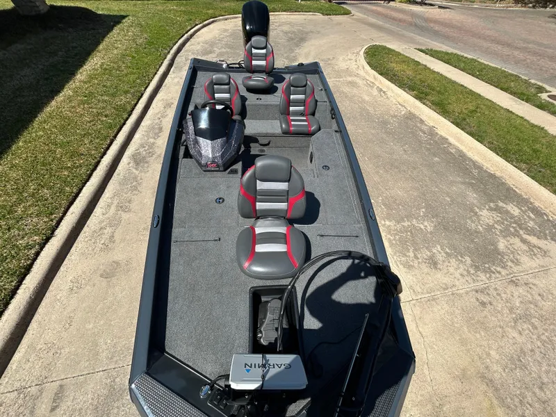 Slide: The Image of 2023 Ranger RT178 fishing boat with seating and Garmin equipment on a driveway. - 9