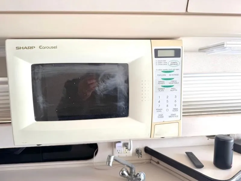 Slide: The Image of Sharp Carousel microwave in a 1989 Carver 30 Santego boat kitchen. - 15