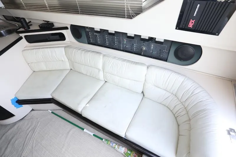 Slide: The Image of 1989 Carver 30 Santego interior with white leather seating and control panel. - 8