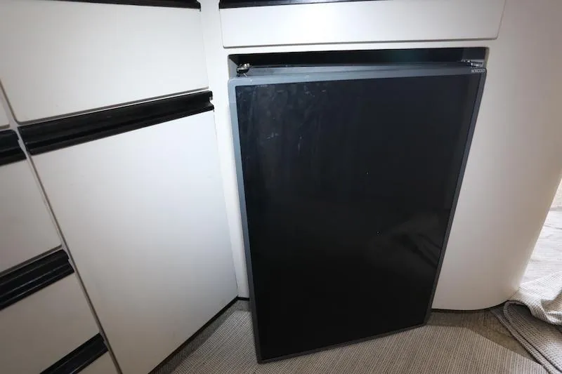 Slide: The Image of Black refrigerator in 1989 Carver 30 Santego boat kitchen interior. - 19