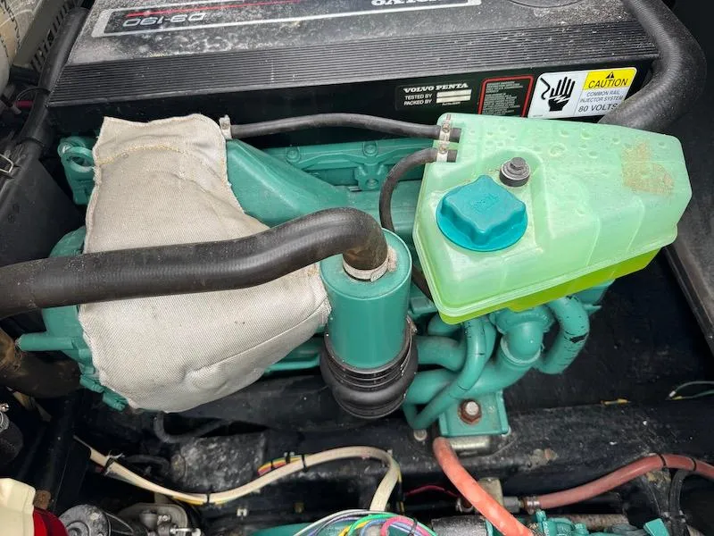 Slide: The Image of Engine compartment of a 1989 Carver 30 Santego boat, featuring Volvo Penta components. - 20