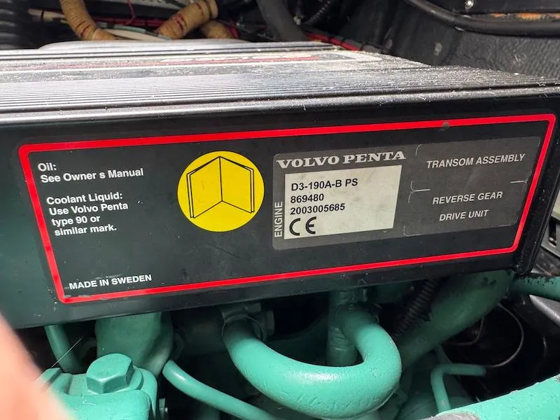 Slide: The Image of Volvo Penta engine label on 1989 Carver 30 Santego, showing specifications and maintenance details. - 22