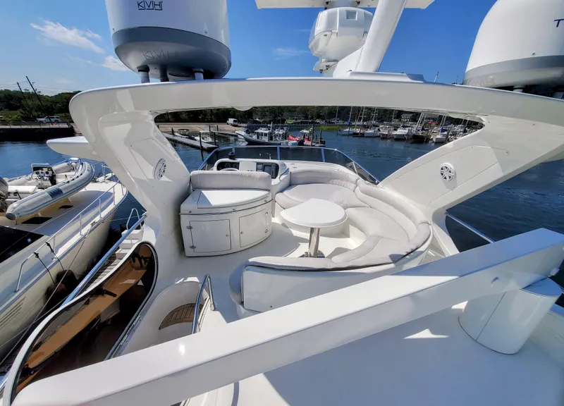 Slide: The Image of Luxurious 2002 Azimut 55 yacht with spacious deck and elegant seating area. - 18