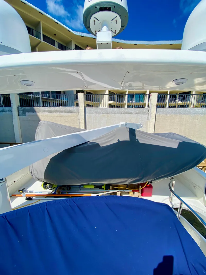 Slide: The Image of Azimut 55 yacht, 2002 model, deck view with covered equipment, sunny day. - 30