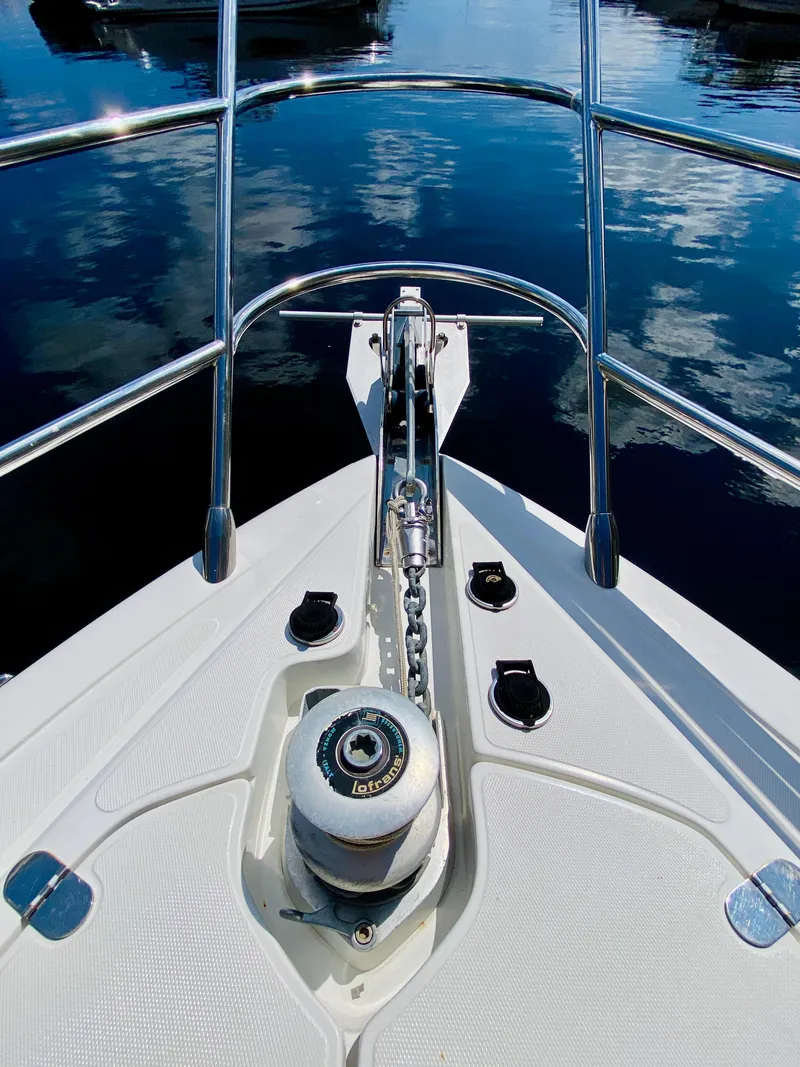 Slide: The Image of Bow of 2002 Azimut 55 yacht with anchor chain and calm water reflection. - 35