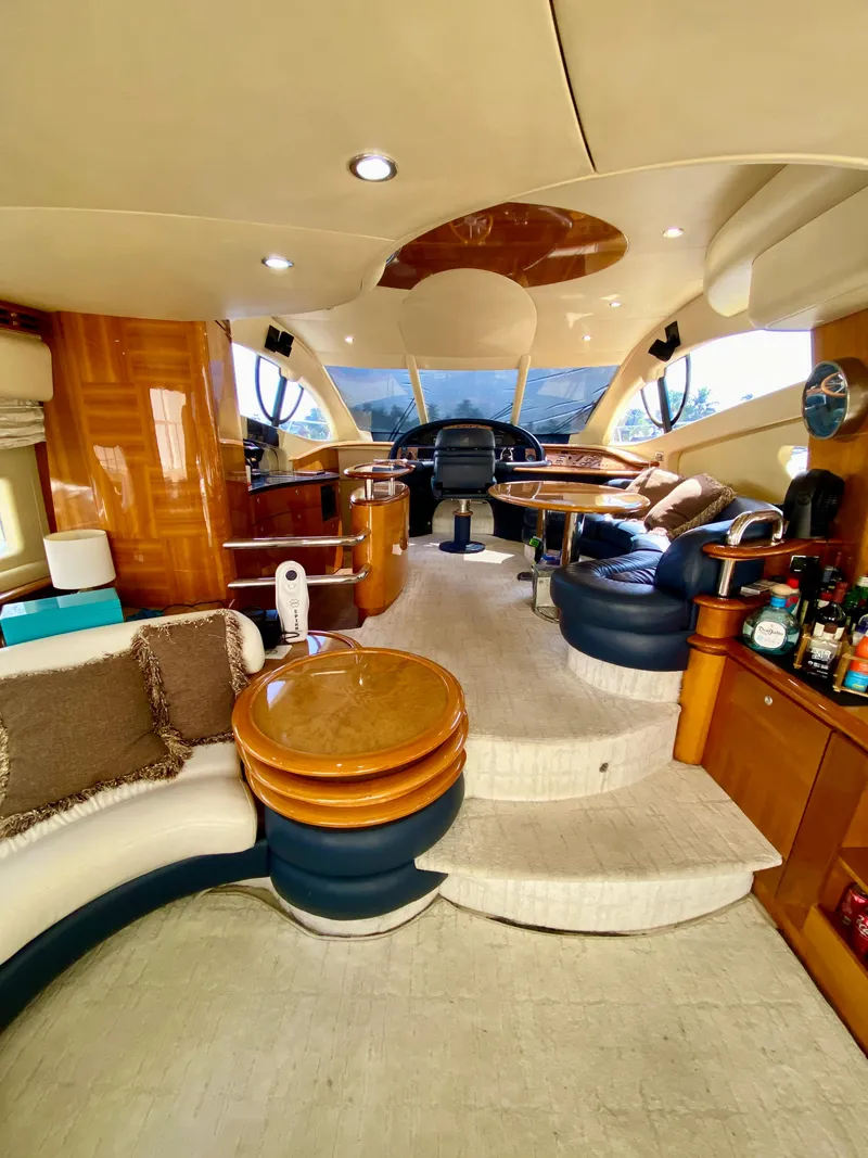 Slide: The Image of Luxurious interior of a 2002 Azimut 55 yacht with elegant seating and modern amenities. - 38