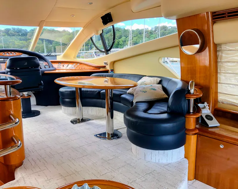 Slide: The Image of Luxurious interior of a 2002 Azimut 55 yacht with elegant seating and wooden accents. - 42