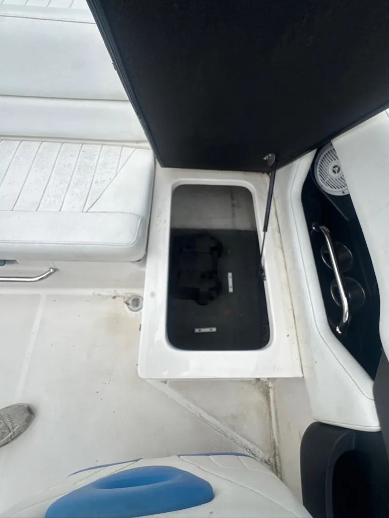 Slide: The Image of Open storage compartment on a 2007 Regal 2000 Bowrider boat interior. - 11