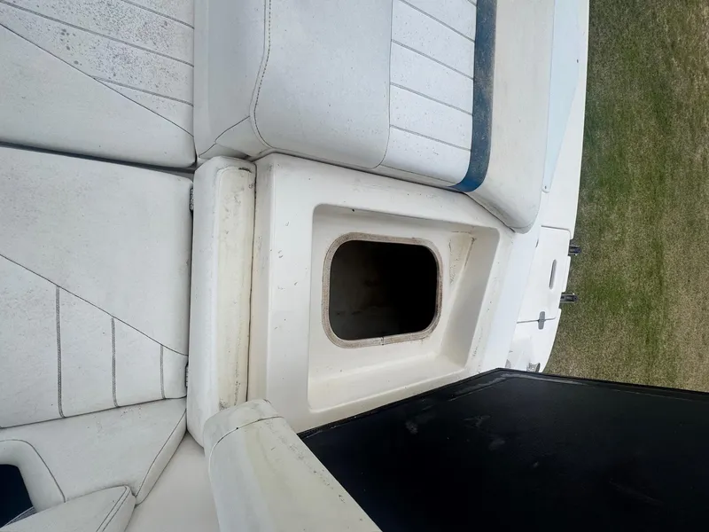 Slide: The Image of 2007 Regal 2000 Bowrider boat interior with open storage compartment. - 12