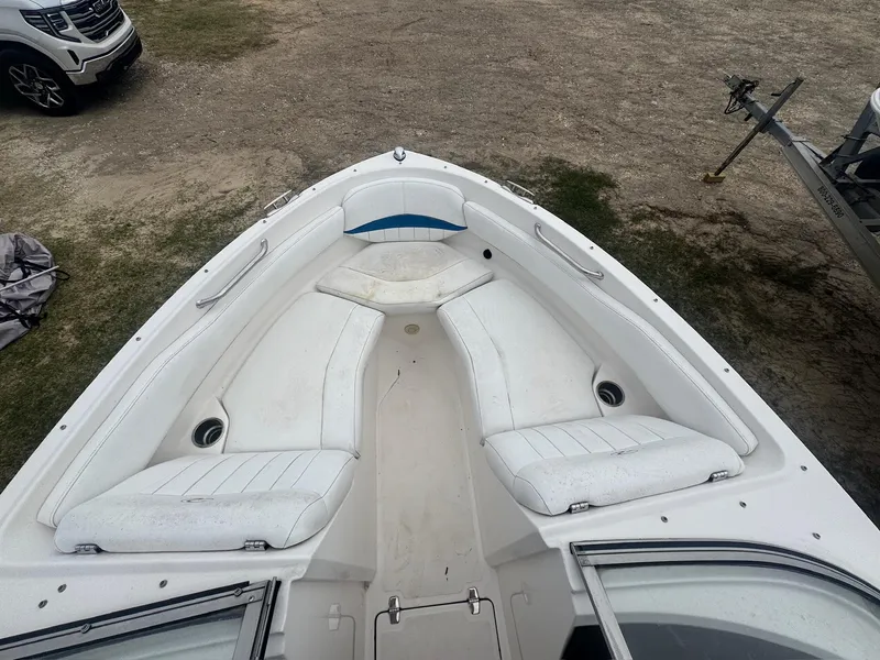 Slide: The Image of 2007 Regal 2000 Bowrider boat interior with white seating and open bow design. - 3