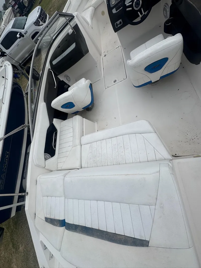 Slide: The Image of 2007 Regal 2000 Bowrider interior with white seating and steering wheel. - 5