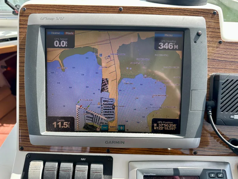 Slide: The Image of Garmin GPS display on 2008 Back Cove 33 Express boat, showing nautical map and coordinates. - 29