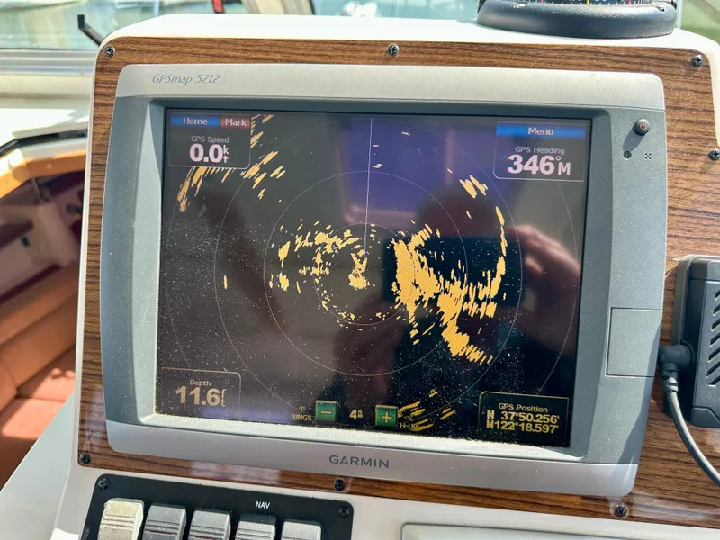 Slide: The Image of Garmin GPS display on 2008 Back Cove 33 Express boat showing radar and navigation data. - 30