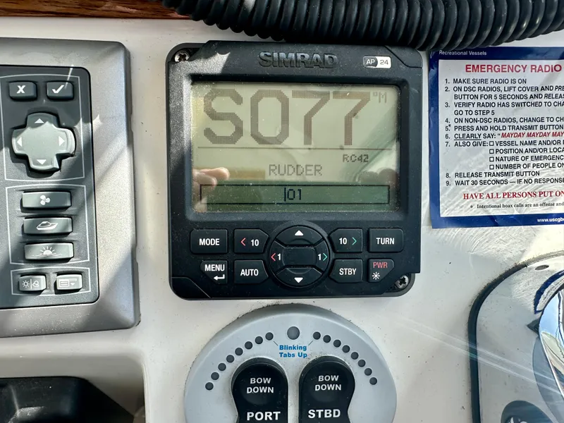 Slide: The Image of Control panel of a 2008 Back Cove 33 Express boat with Simrad display. - 32