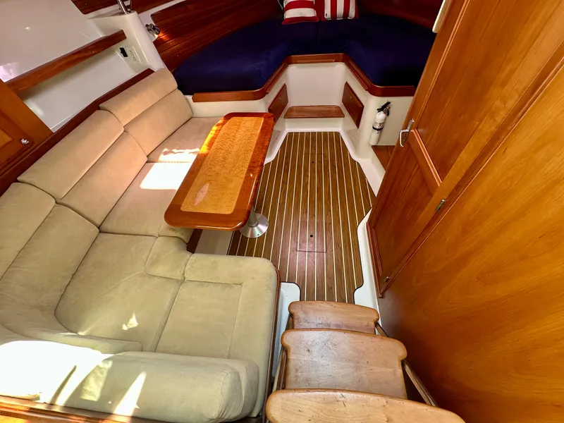 Slide: The Image of Interior of 2008 Back Cove 33 Express with wood flooring and cozy seating area. - 35