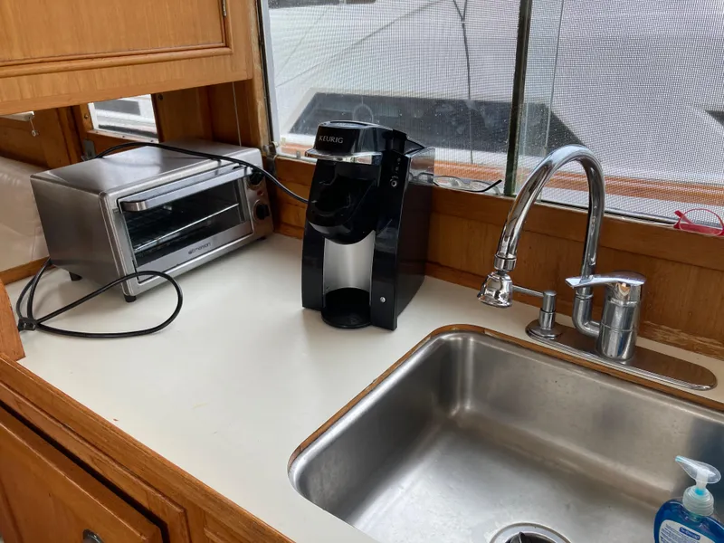 Slide: The Image of Kitchen area of 1985 Grand Banks 42 Classic with sink, coffee maker, and toaster oven. - 17