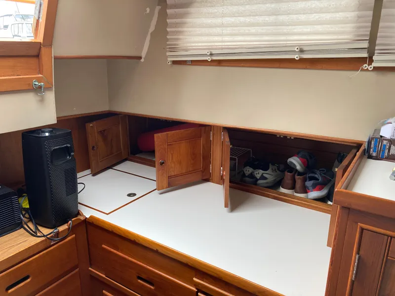 Slide: The Image of Interior of 1985 Grand Banks 42 Classic with wooden cabinets and storage space. - 24