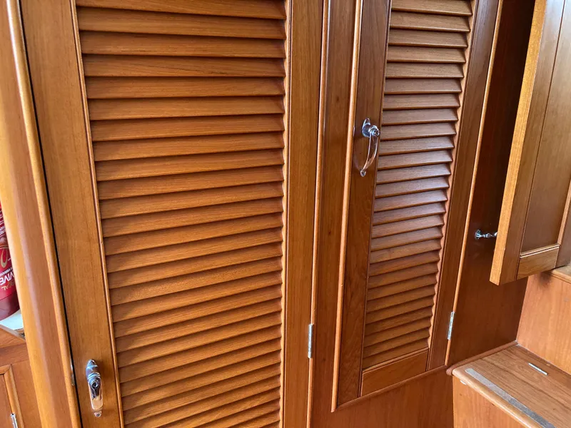 Slide: The Image of Wooden louvered doors on a 1985 Grand Banks 42 Classic yacht interior. - 27