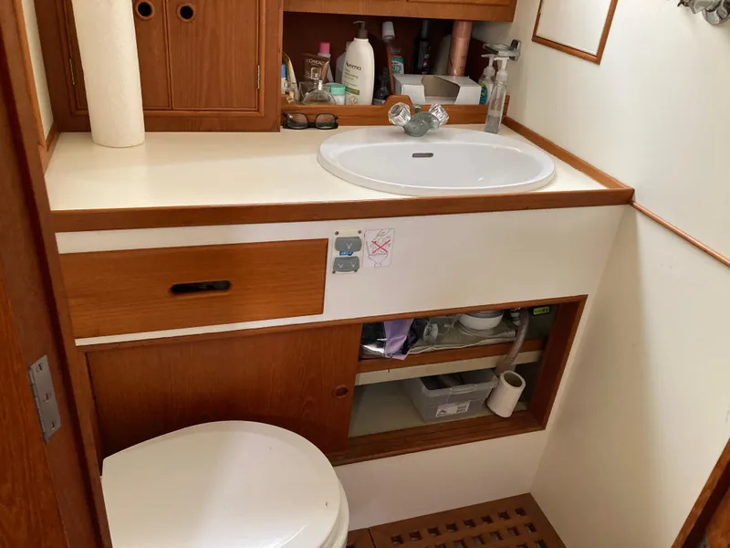 Slide: The Image of Bathroom interior of 1985 Grand Banks 42 Classic yacht with sink and storage. - 29