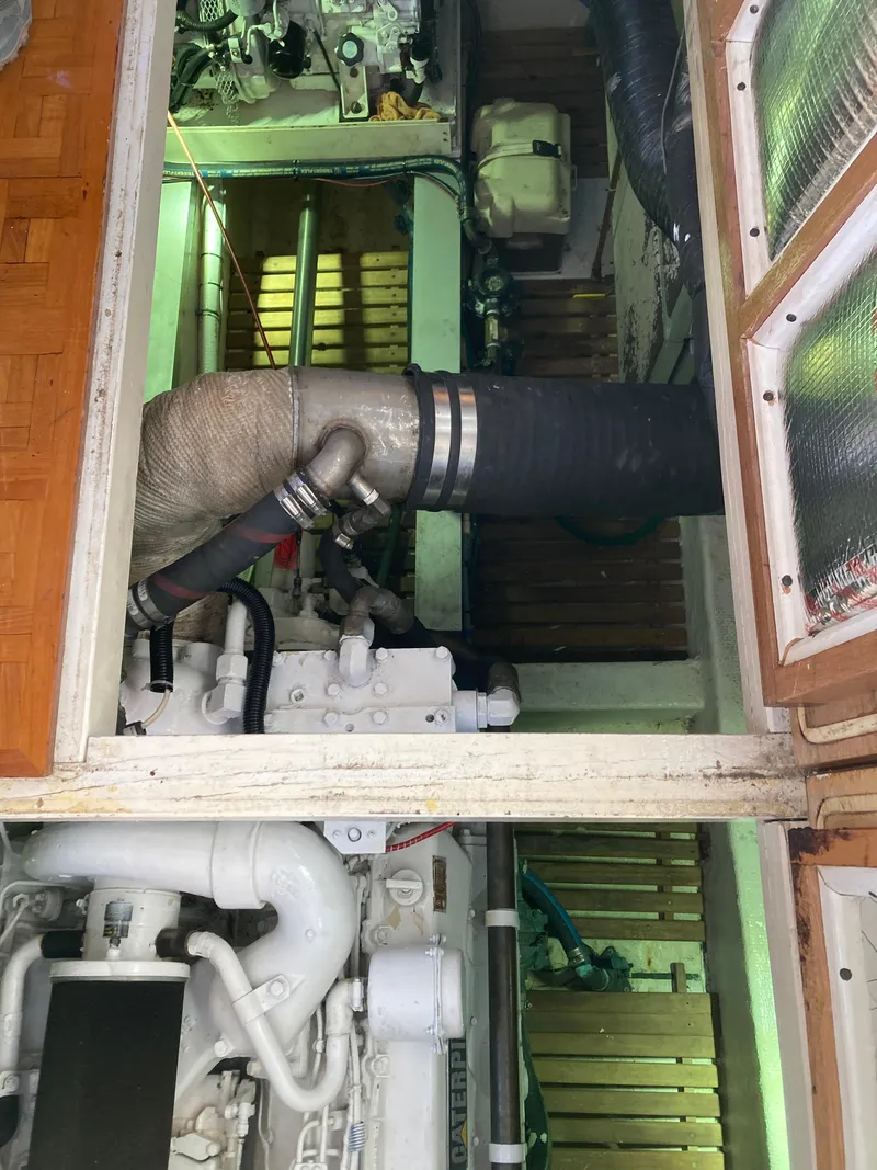 Slide: The Image of Engine room of a 1985 Grand Banks 42 Classic yacht, showcasing mechanical components. - 31