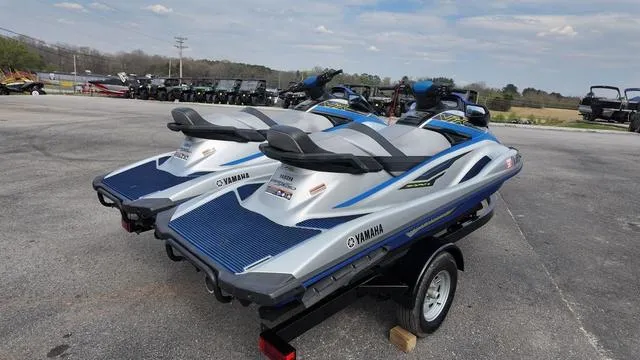 Slide: The Image of 2020 Yamaha Waverunner VX Cruiser jet skis on a trailer in a parking lot. - 7