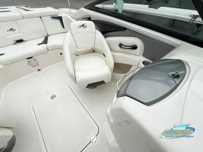 Slide: The Image of 2014 Monterey 244FS boat interior with white seating and sleek design. - 21