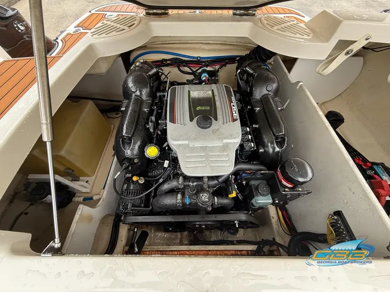 Slide: The Image of 2014 Monterey 244FS boat engine compartment with visible engine components. - 22