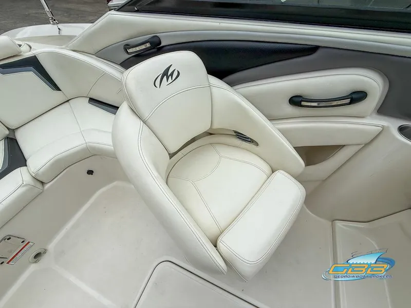 Slide: The Image of 2014 Monterey 244FS boat interior with white leather seating and logo. - 24