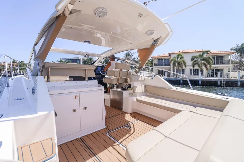 Slide: The Image of Luxurious 2016 Pursuit SC 365i yacht interior with spacious seating and modern amenities. - 15