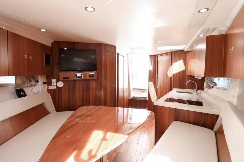Slide: The Image of Luxurious interior of 2016 Pursuit SC 365i yacht with wood finish and modern amenities. - 22