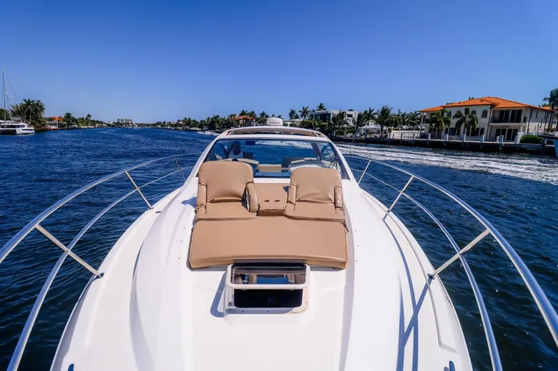 Slide: The Image of 2016 Pursuit SC 365i yacht cruising on a sunny day with luxurious deck seating. - 7