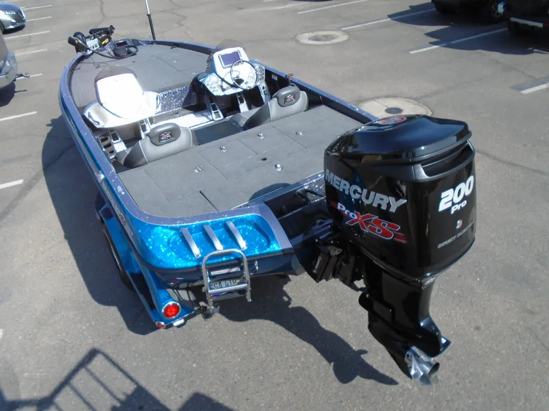 Slide: The Image of 2018 Ranger Z518 Comanche boat with Mercury 200 Pro XS engine in a parking lot. - 9